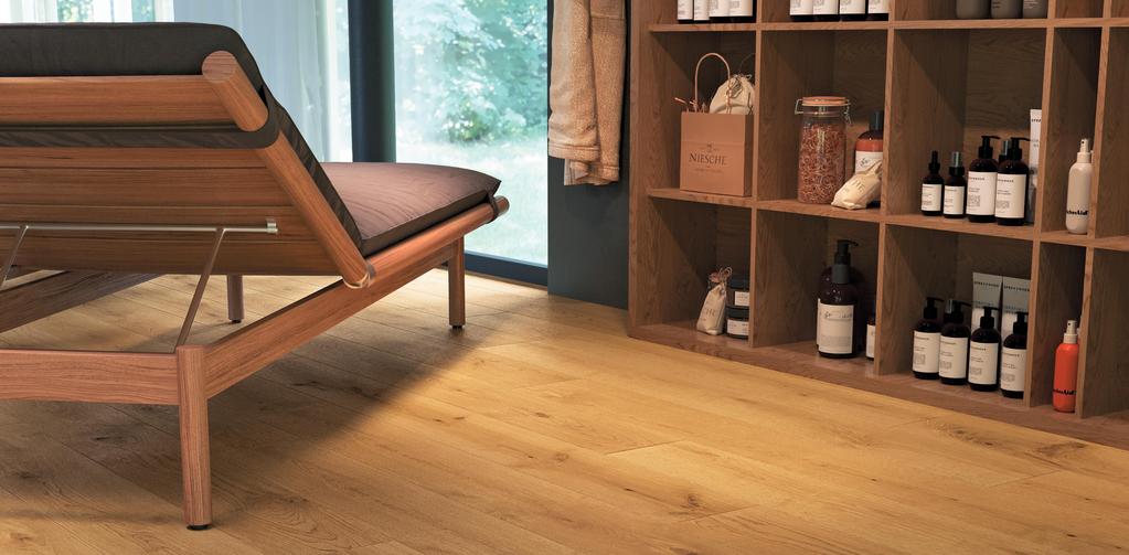 Relaxation room with light wood-effect floor, shelves with cosmetics and wooden chaise longue.