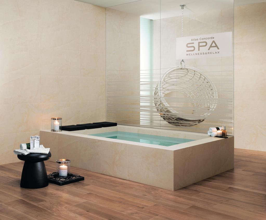 Interior SPA with dark wood floor, modern bath and suspended seat in wicker.