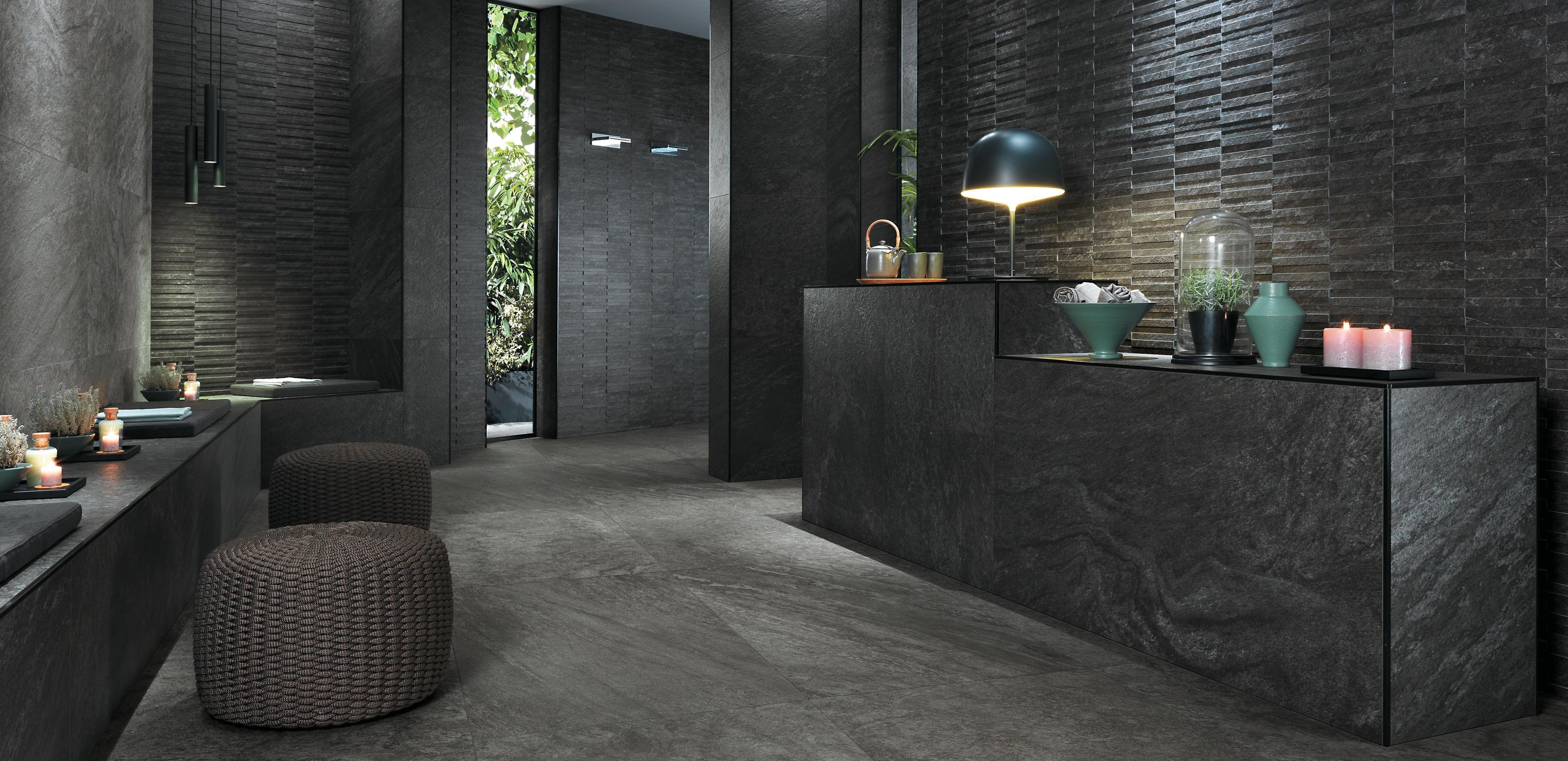 Space with natural stone-effect porcelain stoneware flooring and minimalist decor.